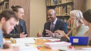 Group of school leaders collaborating - How school leadership teams lead to success