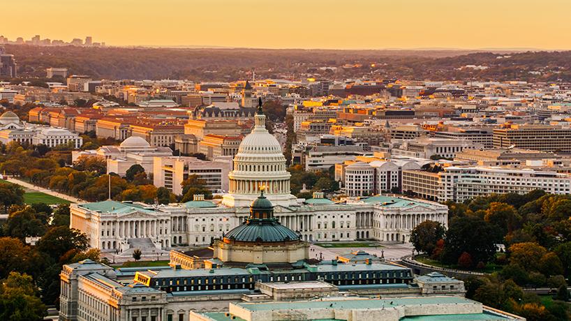 Aerial shot of u.s. capitol building and library of congress at sunset