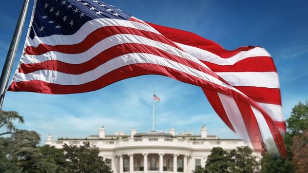 American flag in front of the white house