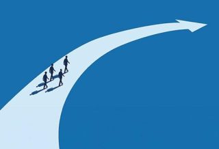 group of people following the path drawn by an arrow on the ground