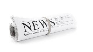 Rolled Newspaper isolated on white